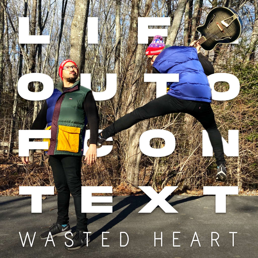 Mischievious Sterling smashing Innocent Sterling with a guitar. Life Out of Context by Wasted Heart Cover Art